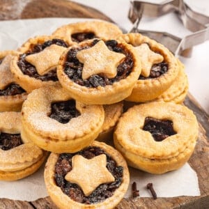 Pile of mince pies on wooden board