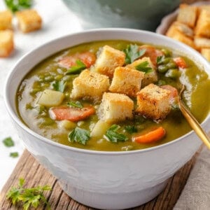 Bowl of vegan split pea soup with spoon