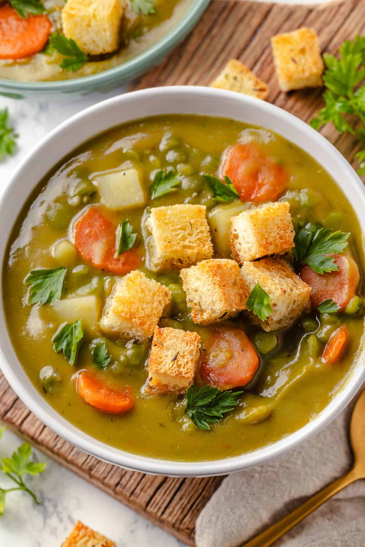 Vegan split pea soup in bowl with croutons