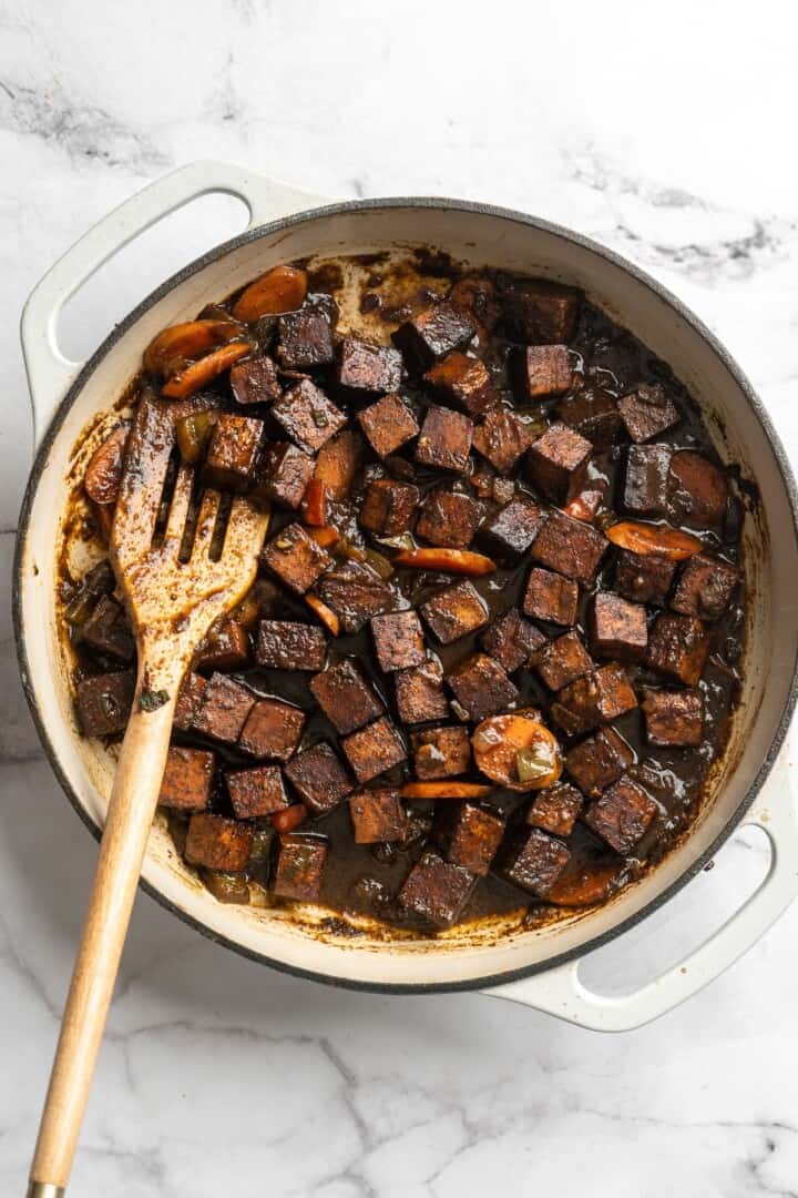 Overhead view of brown stew tofu in skillet