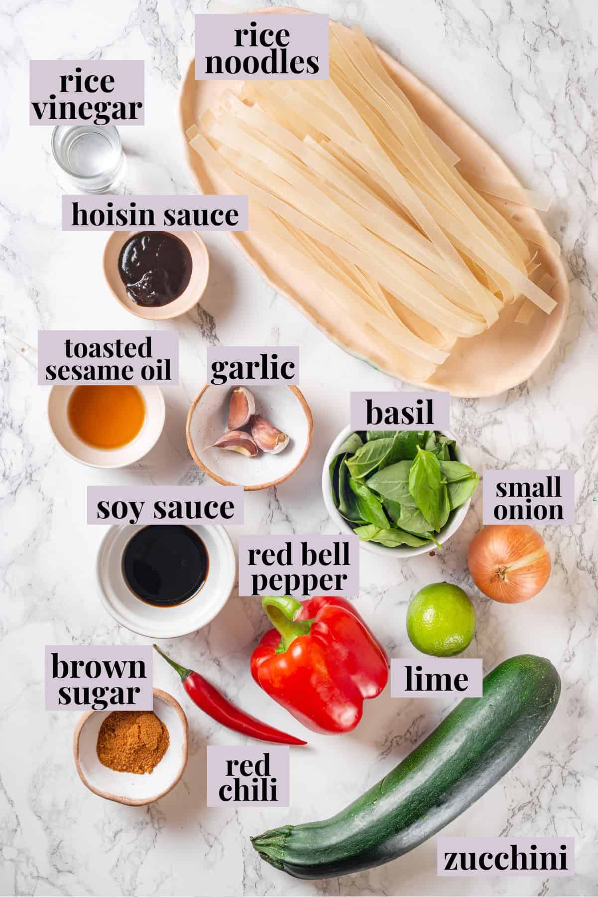 Overhead view of ingredients for drunken noodles with labels