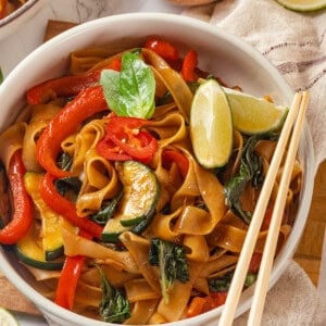 Vegan drunken noodles in bowl with chopsticks