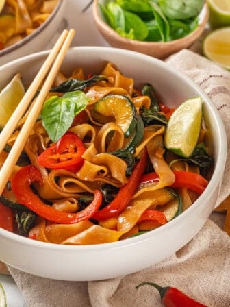 Bowl of vegan drunken noodles with chopsticks