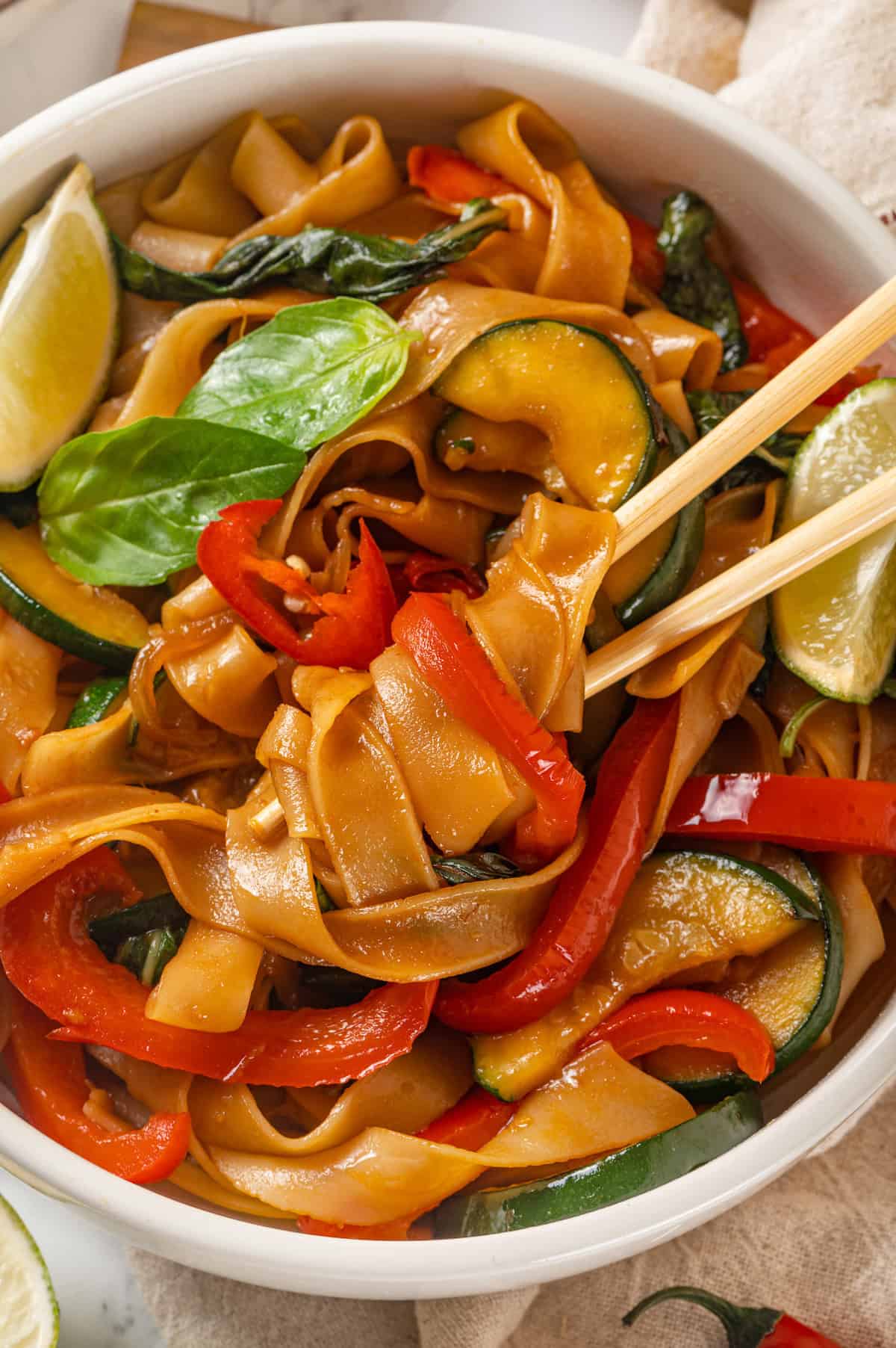 Chopsticks in bowl of drunken noodles