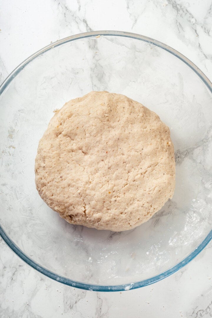 Overhead view of naan dough in bowl