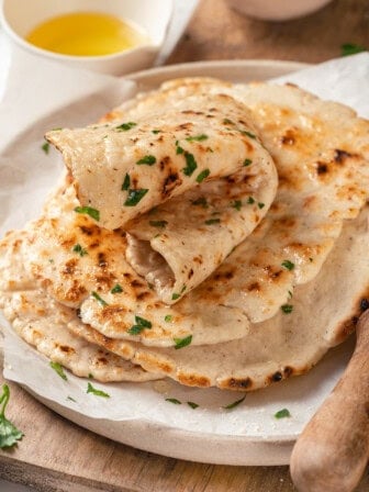 Stack of gluten-free naan on plate