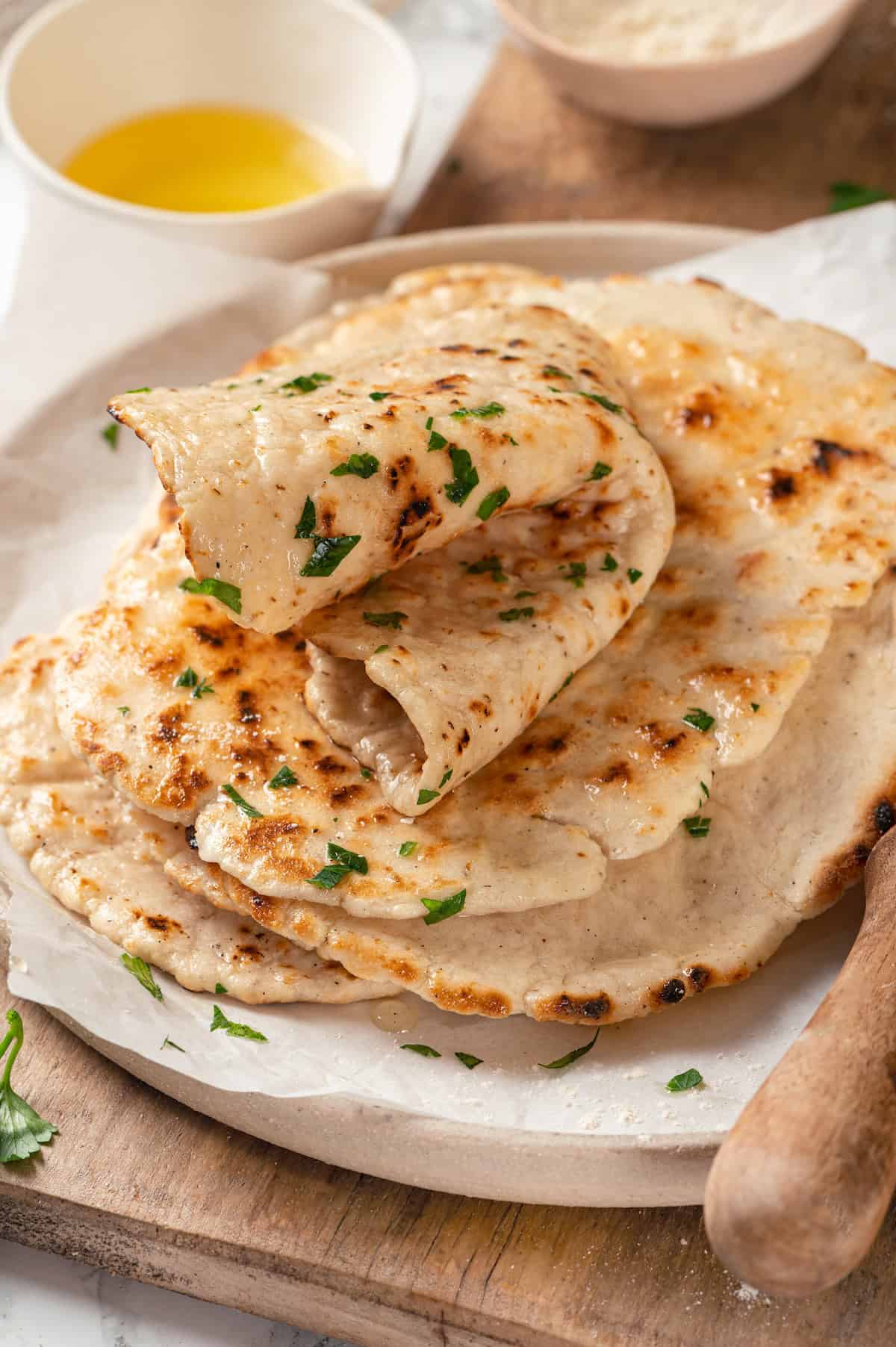 Stack of gluten-free naan on plate