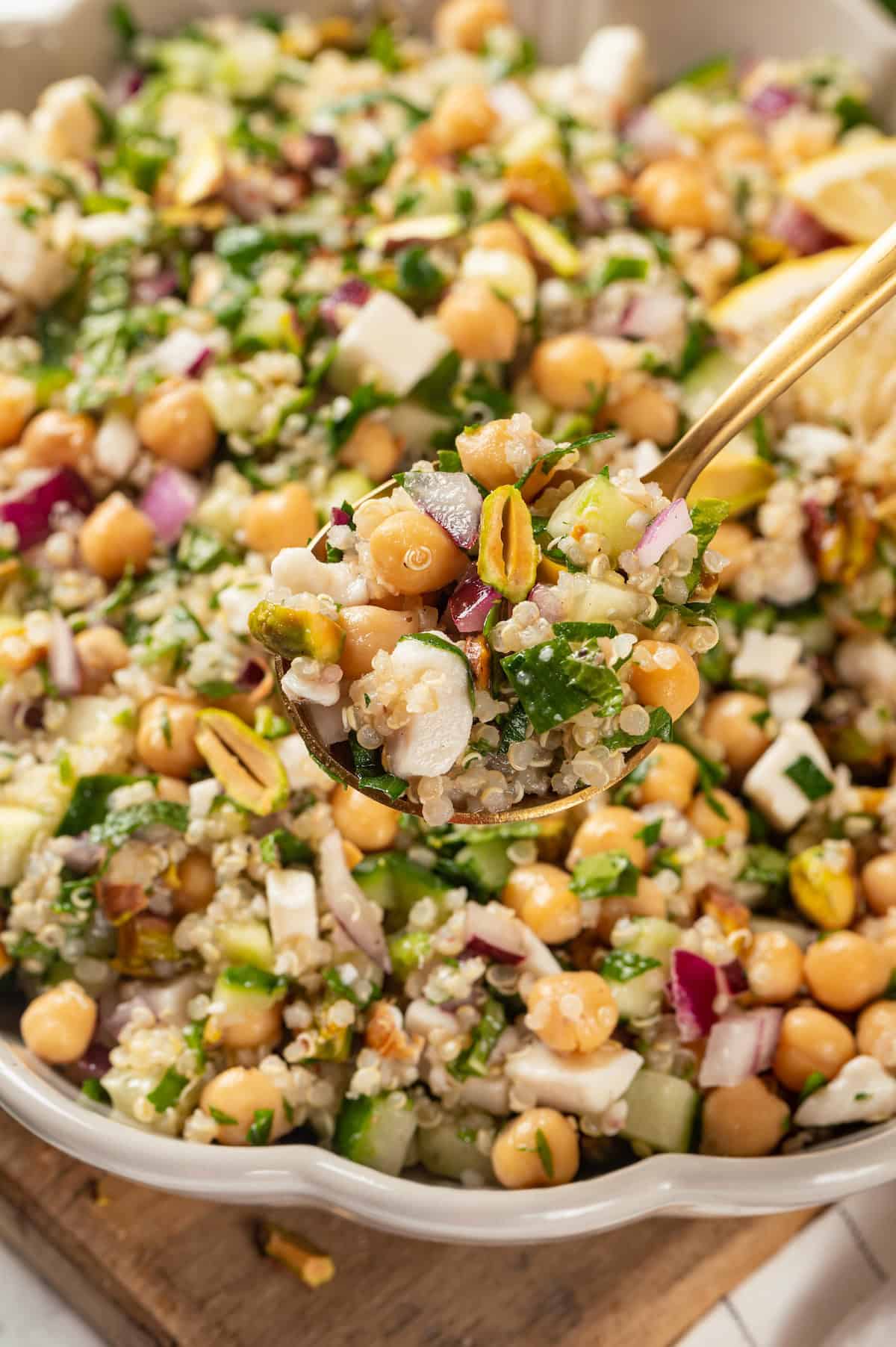 Spoonful of Jennifer Aniston salad held over bowl