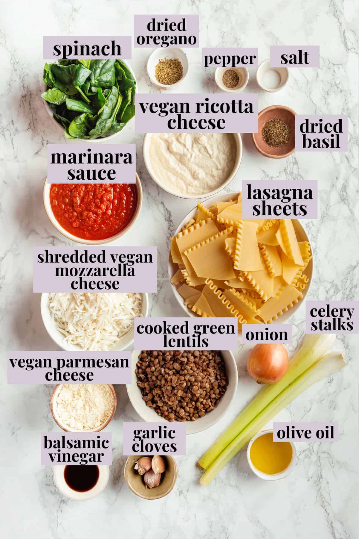 Overhead view of ingredients for sheet pan lasagna with labels