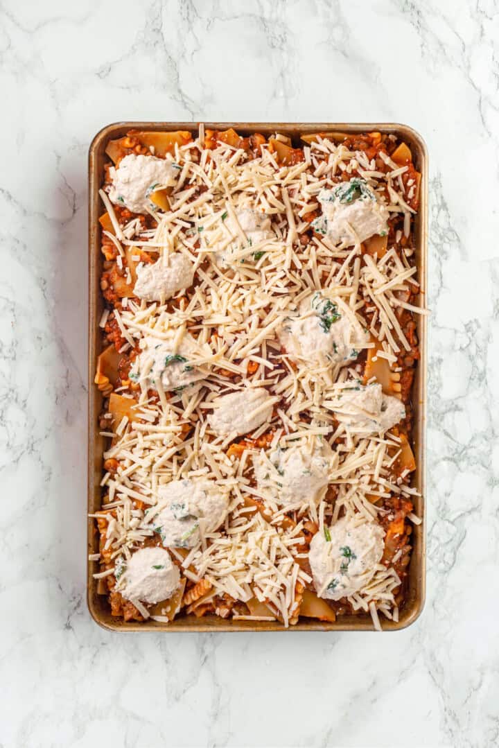 Overhead view of sheet pan lasagna before baking