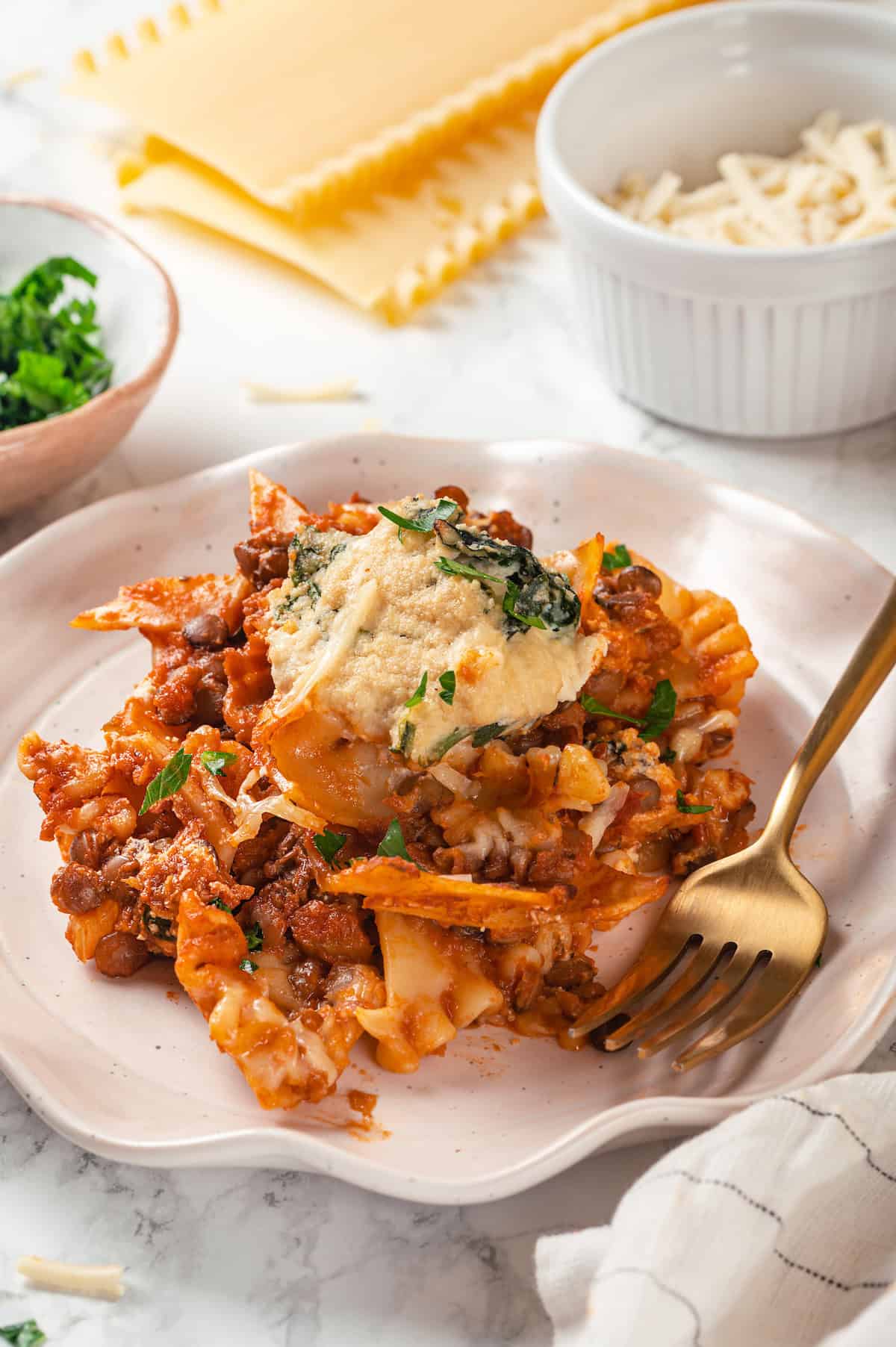 Vegan sheet pan lasagna on plate with fork