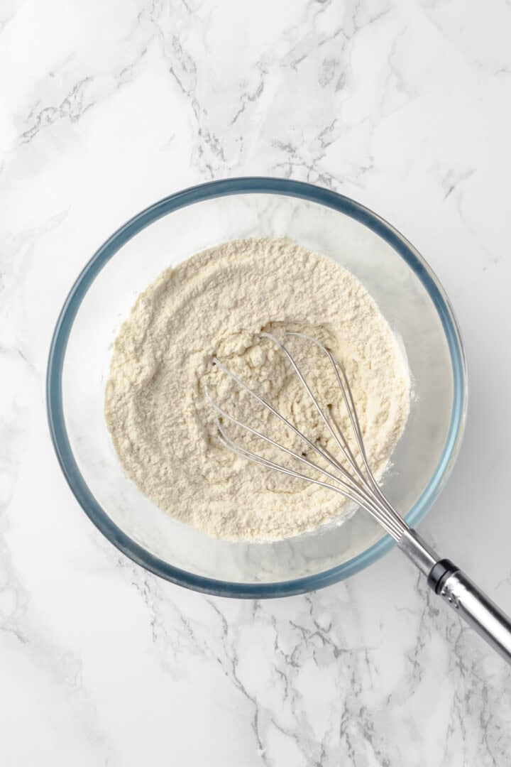 Dry ingredients in mixing bowl with whisk