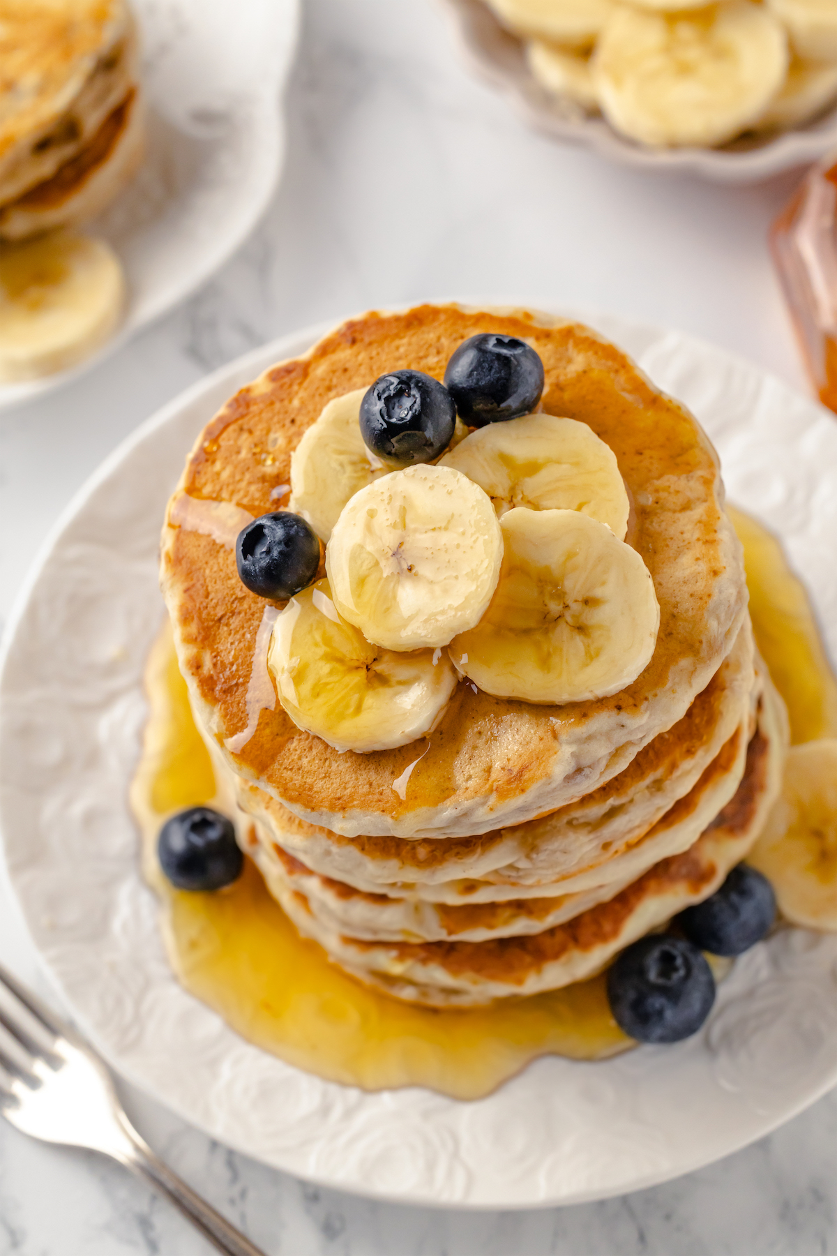 Top-down view of banana pancakes on plate