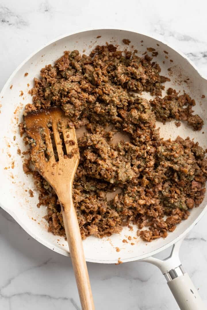 Browning vegan beef in skillet