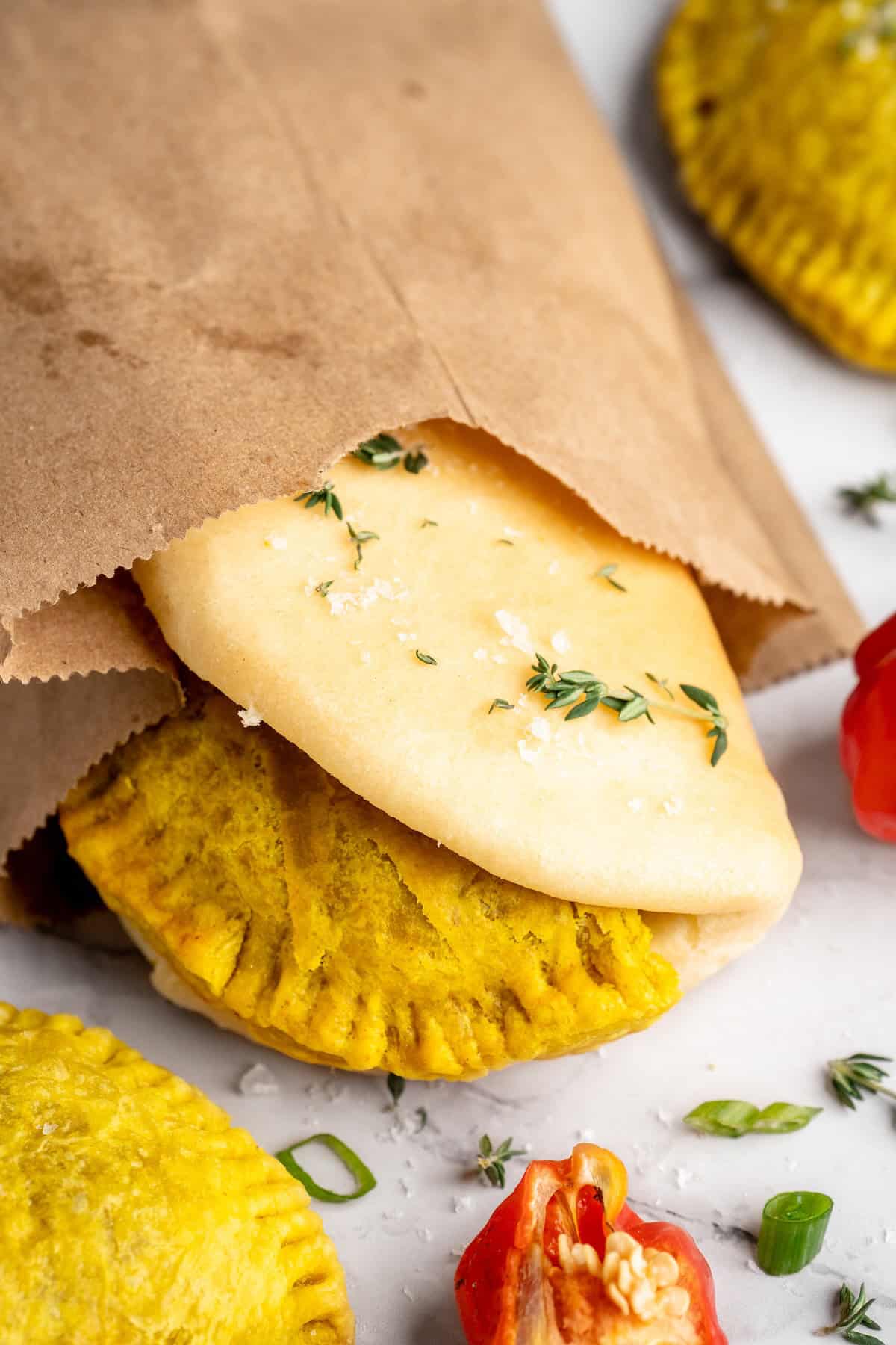 Homemade vegan Jamaican patties in paper bag