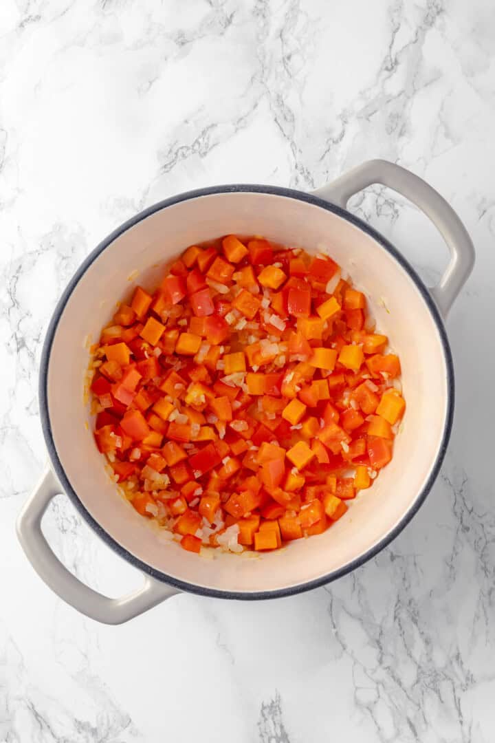 Overhead view of softened vegetables in pot