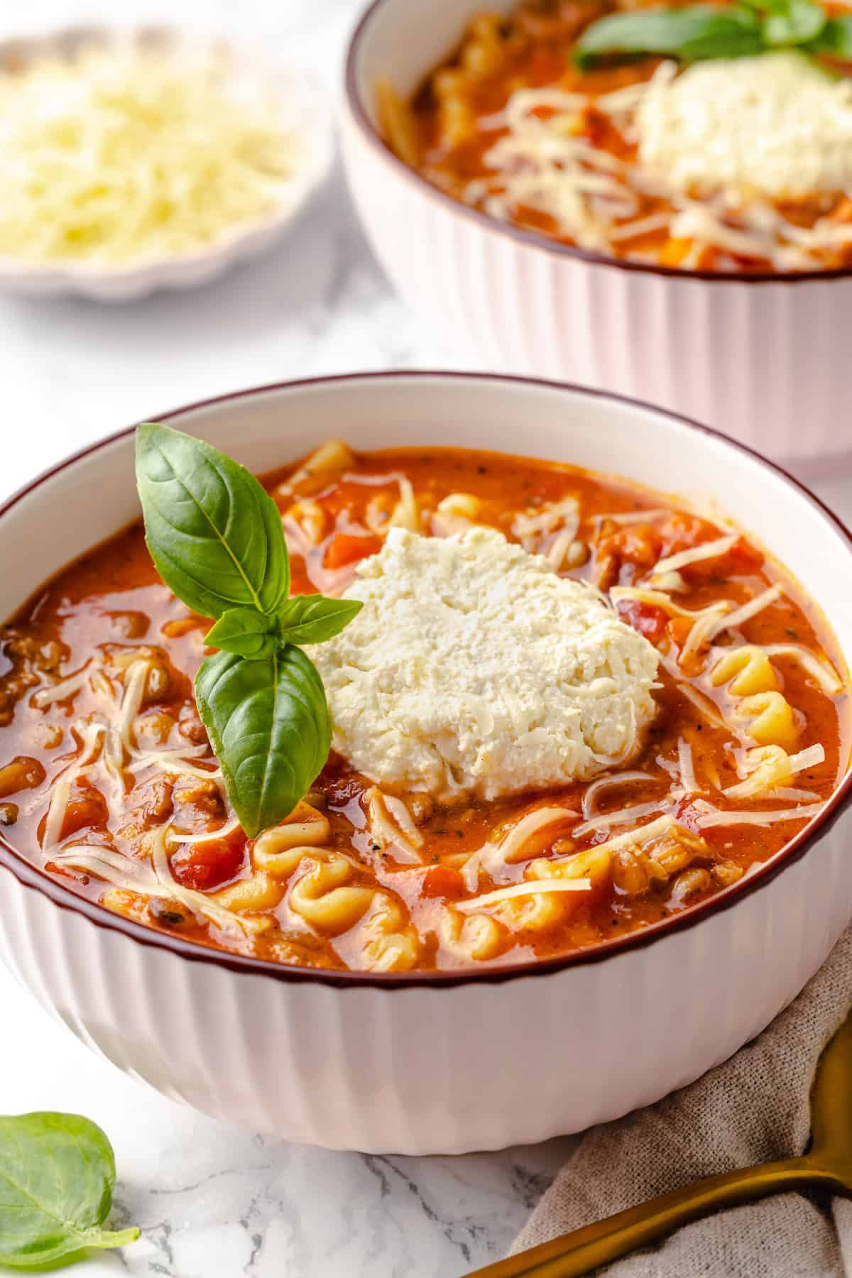 Two bowls of vegan lasagna soup