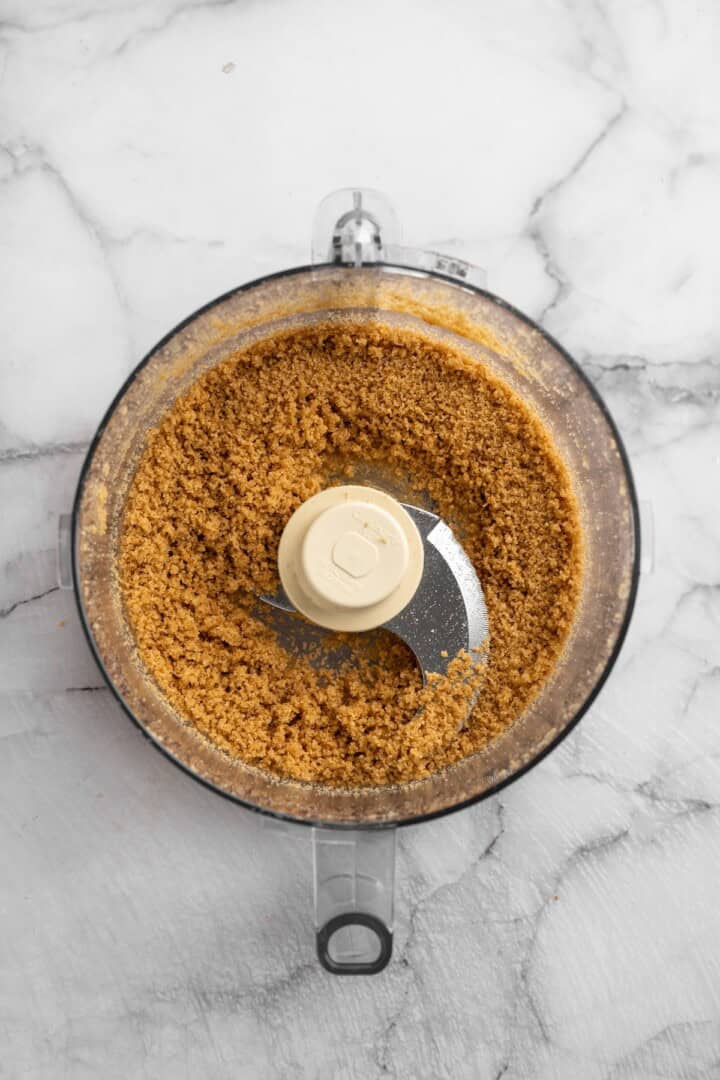 Graham cracker crust mixture in food processor bowl