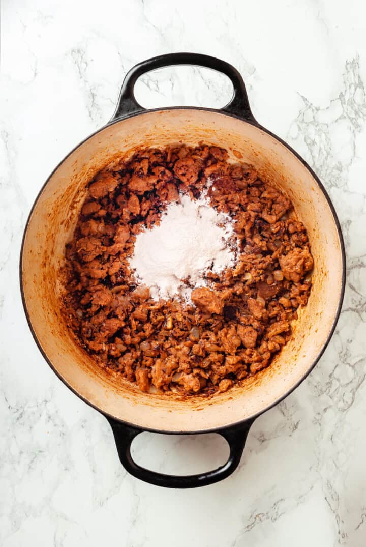 Flour added to pot of browned sausage