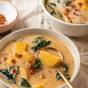 Two bowls of vegan zuppa toscana