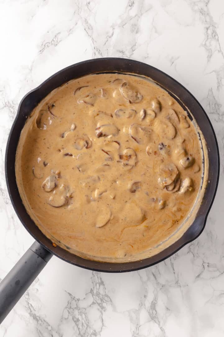 Creamy mushroom sauce in skillet