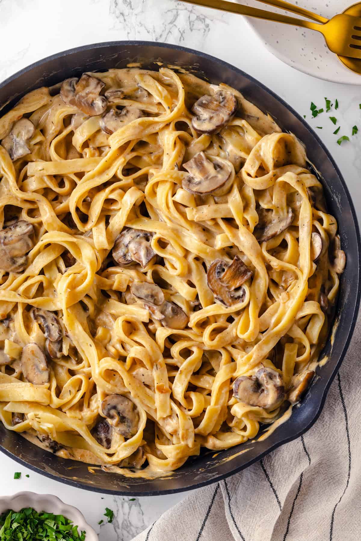 Overhead view of mushroom stroganoff in cast iron skillet