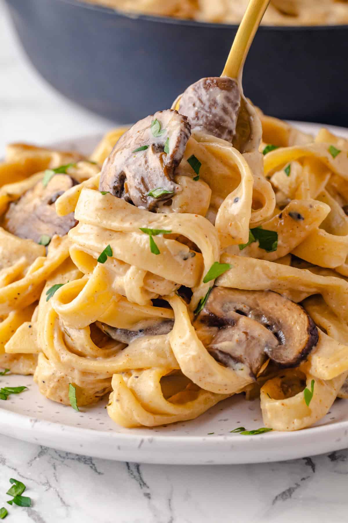 Creamy mushroom stroganoff on plate with fork