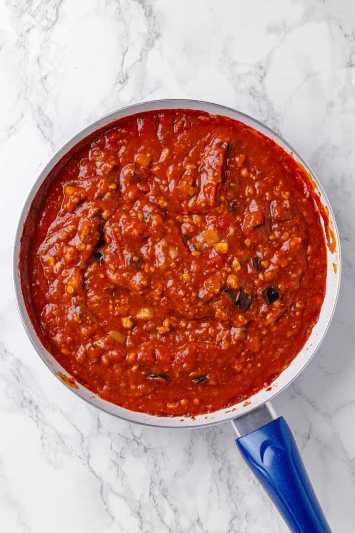 Overhead view of sauce for baked spaghetti in pan