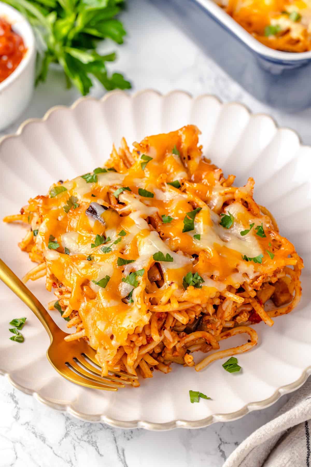 Plate of baked spaghetti with fork