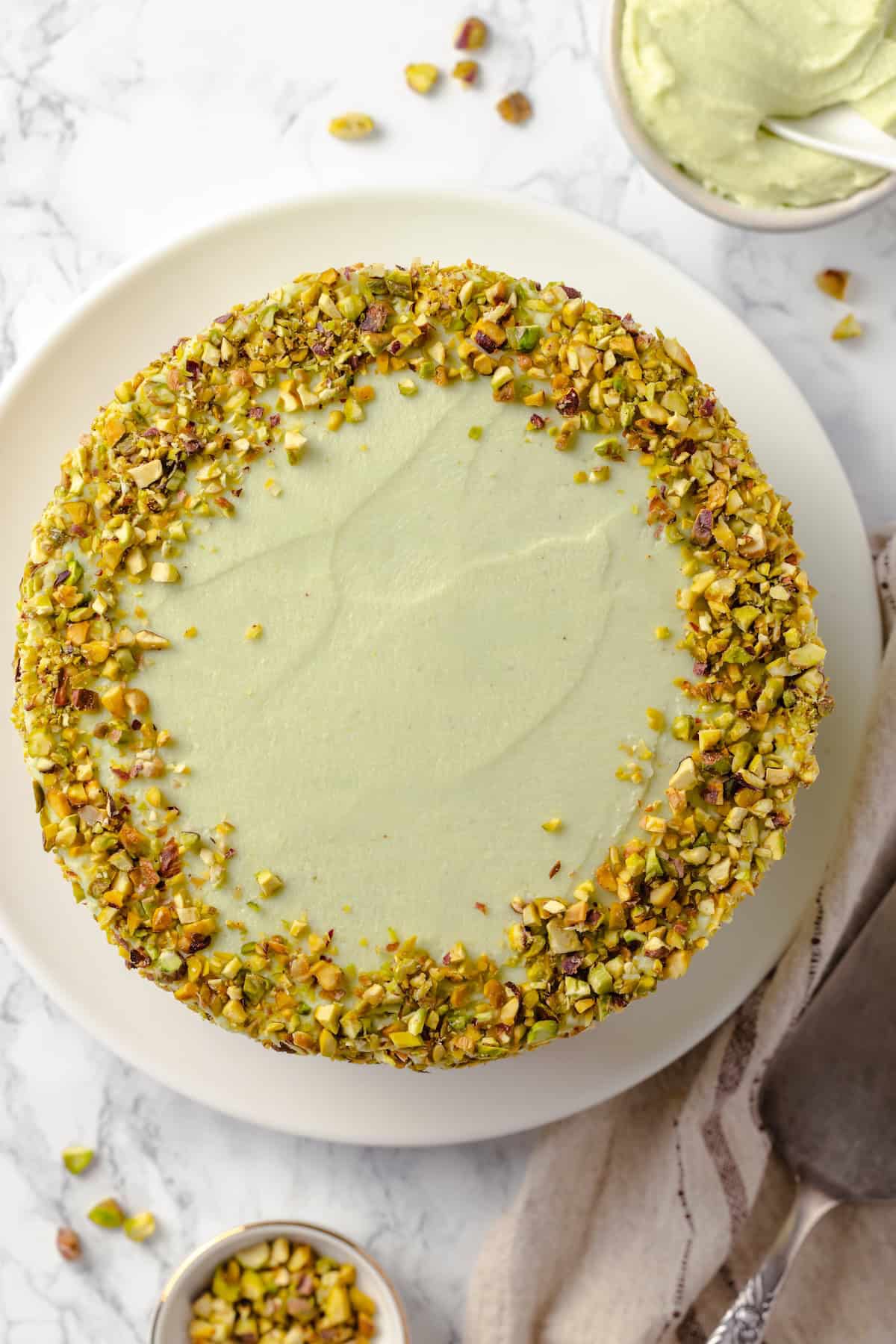 Overhead view of pistachio cake on platter