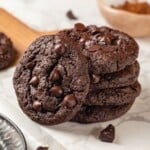 Stack of 4 double chocolate chunk cookies with a fifth leaning against them