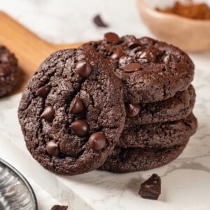 Stack of 4 double chocolate chunk cookies with a fifth leaning against them