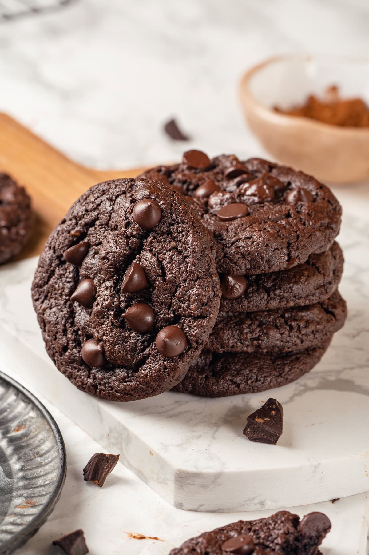 Stack of 4 double chocolate chunk cookies with a fifth leaning against them