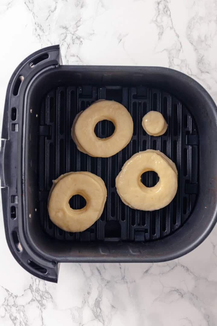 Overhead view of dough for air fryer donuts in basket