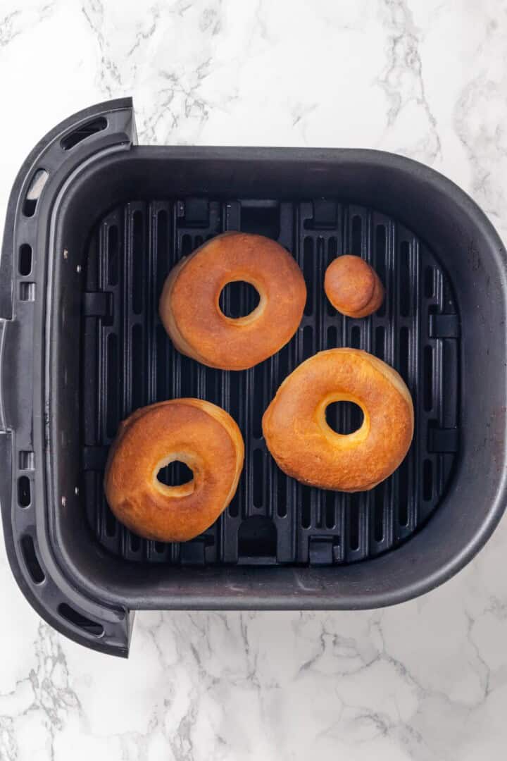 Overhead view of air fryer donuts in basket