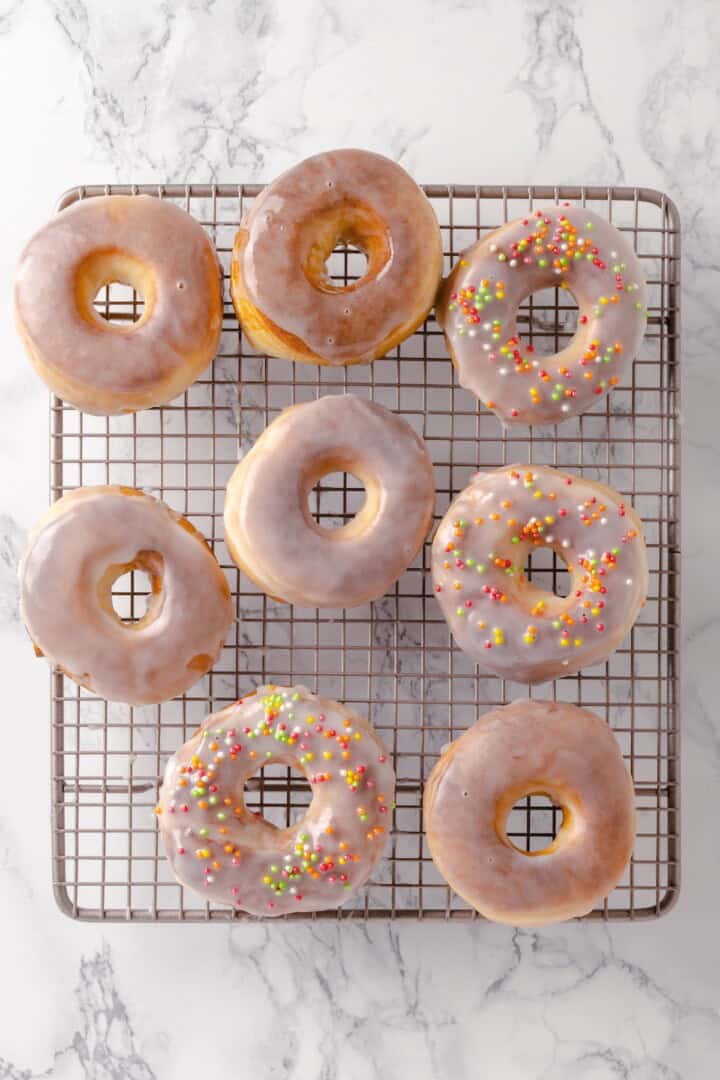 Overhead view of vegan air fryer donuts on wire rack