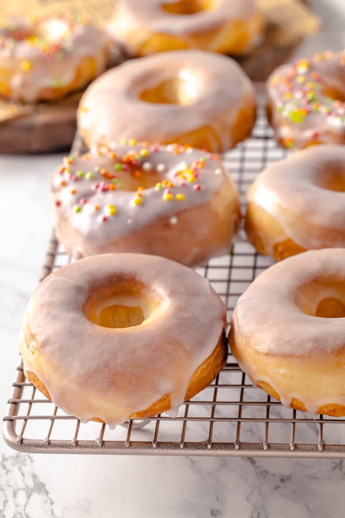 Vegan air fryer donuts on wire rack to cool