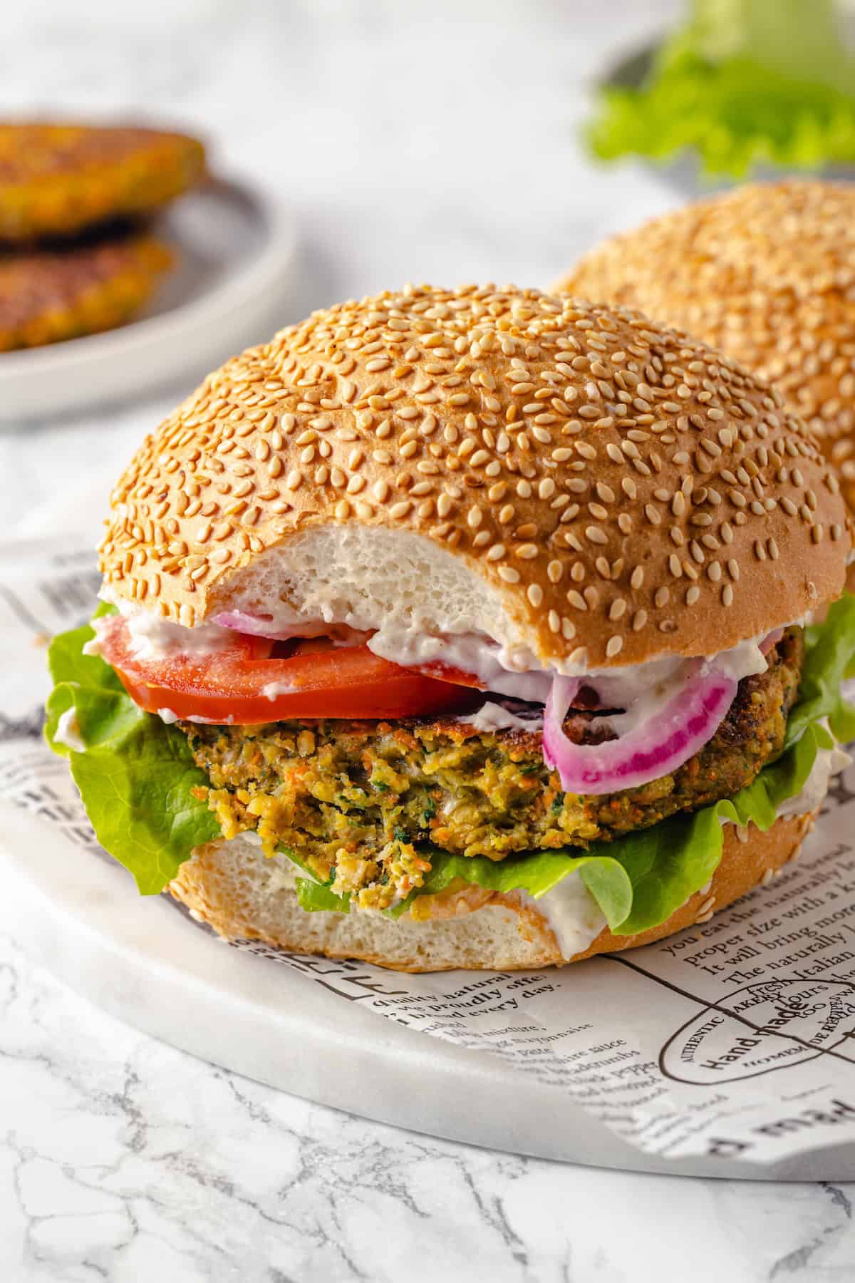 Vegan falafel burger with bite taken out
