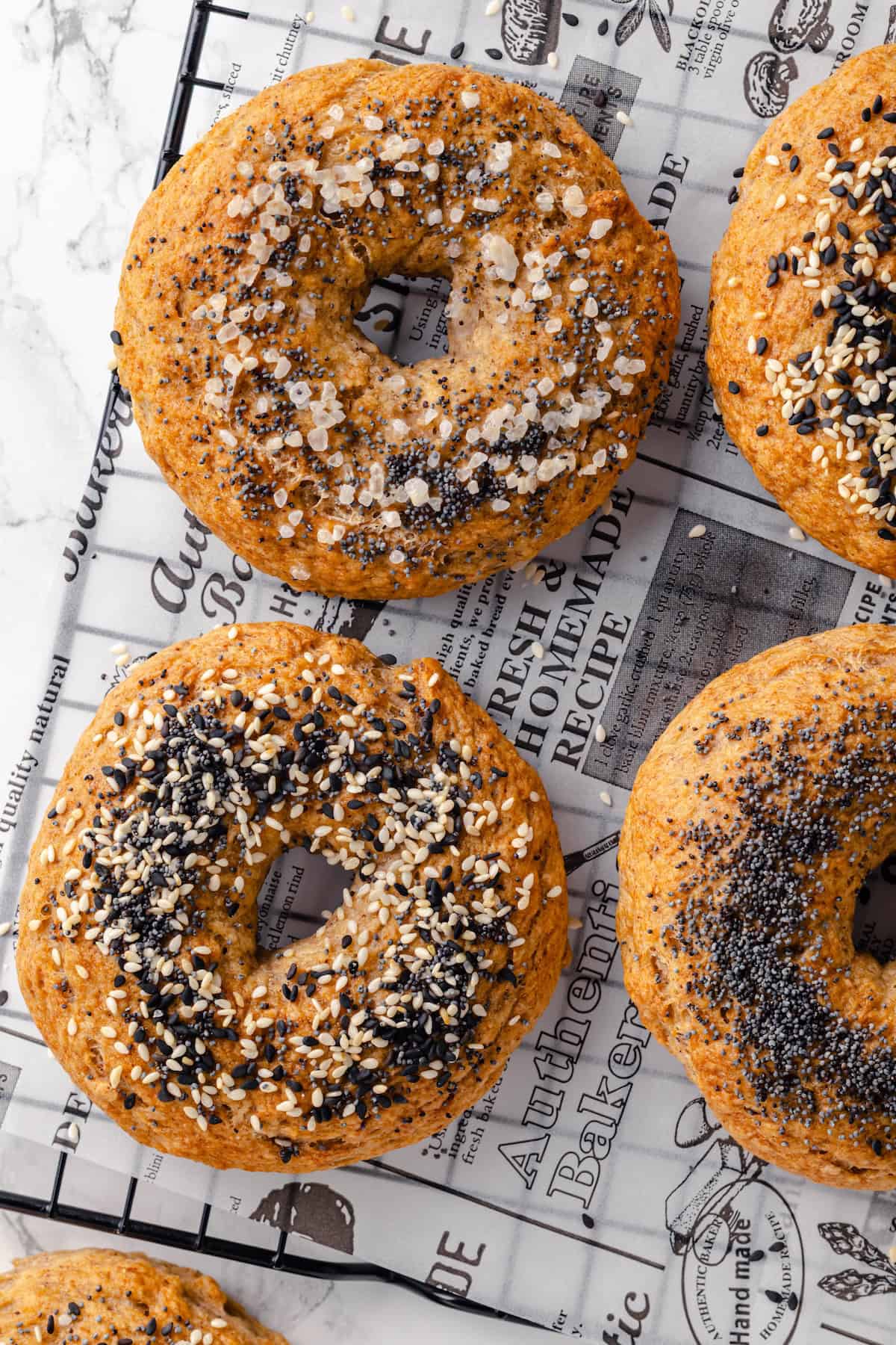 Overhead view of gluten-free bagels on wire rack