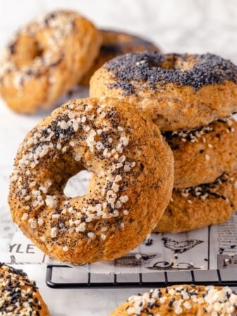 Stack of 3 gluten-free bagels with another leaning against it
