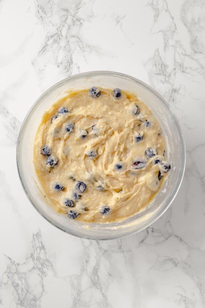 Overhead view of lemon blueberry Bundt cake batter in bowl