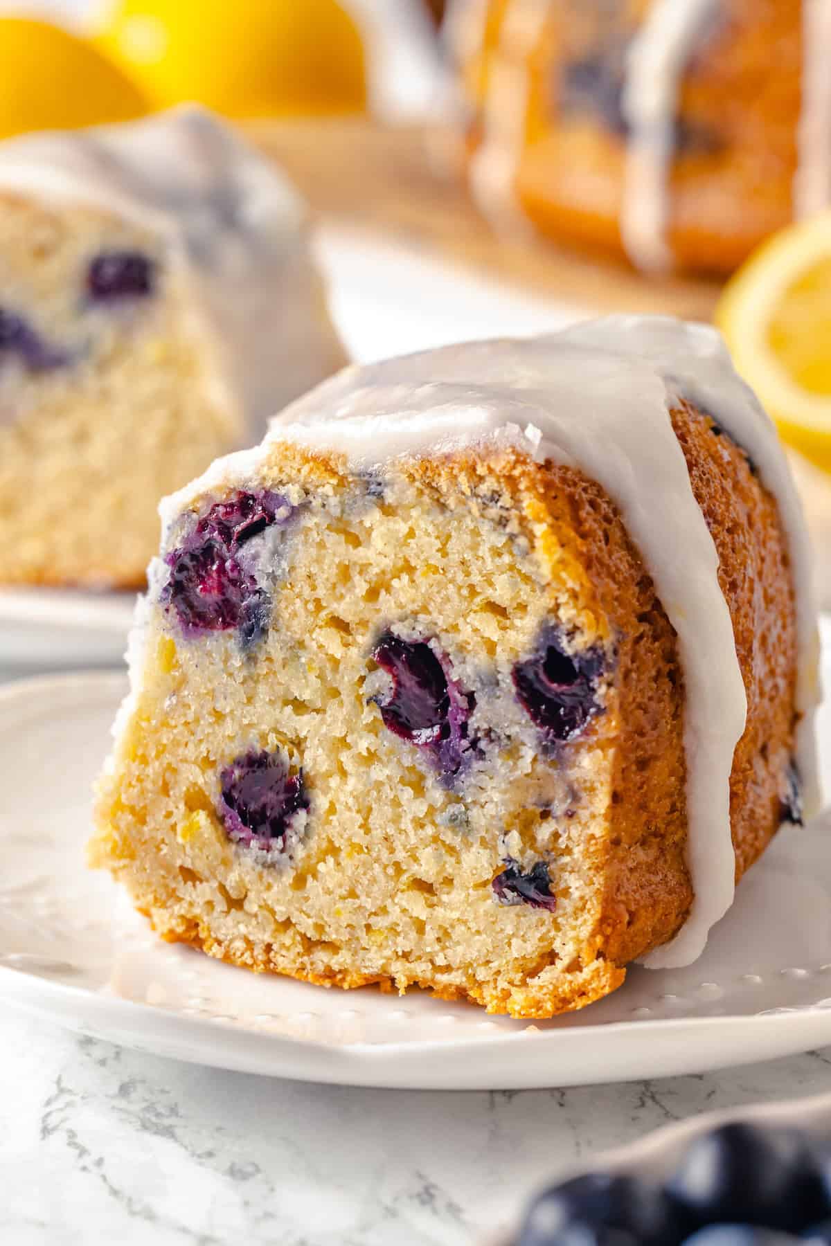 Slice of lemon blueberry Bundt cake on plate