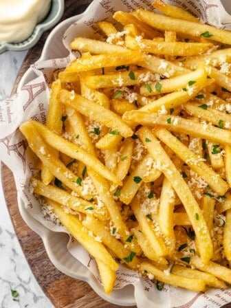 Overhead view of crispy vegan truffle fries in bowl