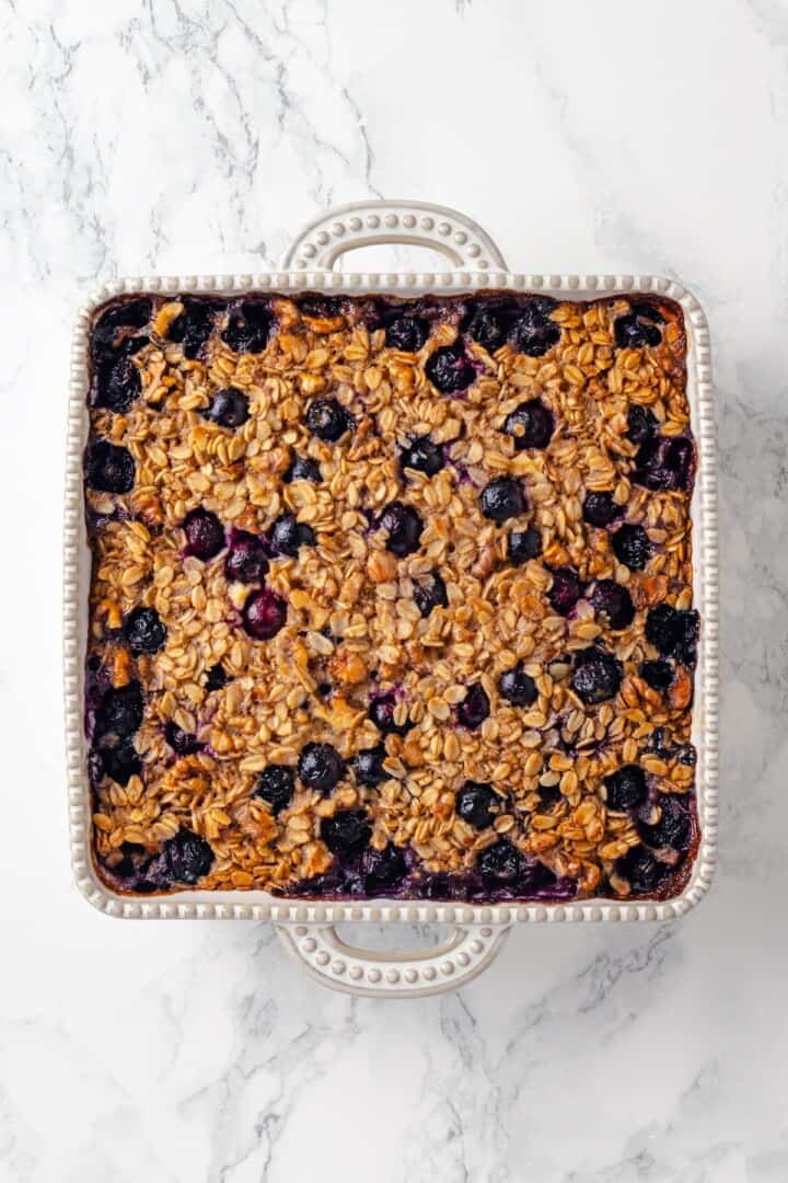 Overhead view of blueberry baked oatmeal in baking dish
