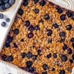 Overhead view of blueberry baked oatmeal in baking dish