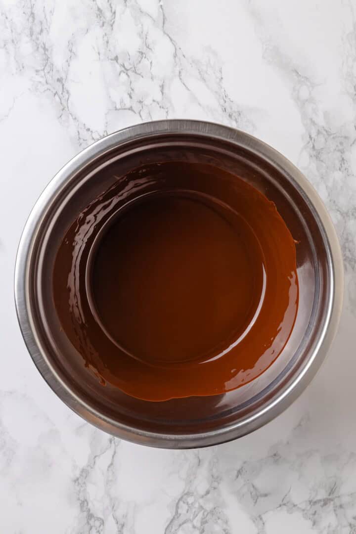 Overhead view of chocolate and coconut oil melted in bowl