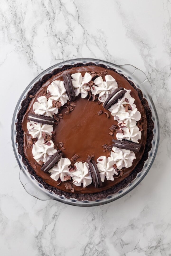 Overhead view of whole chocolate mousse pie in glass dish