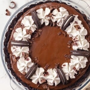 Overhead view of whole chocolate mousse pie in glass pie dish