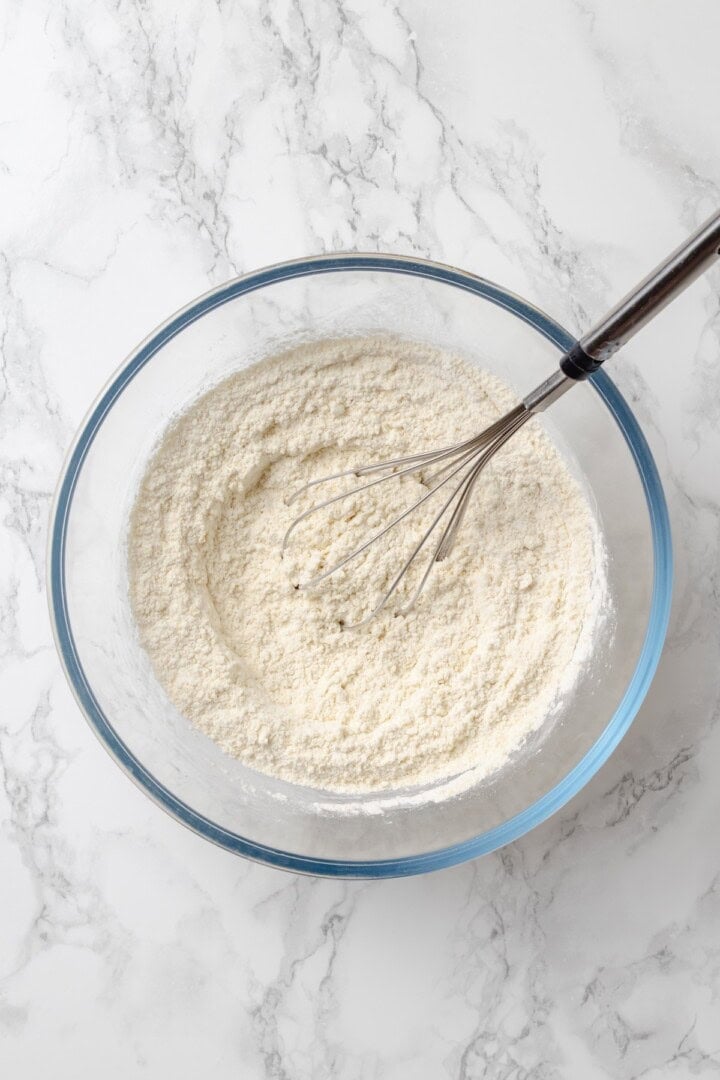 Whisking dry ingredients in glass bowl
