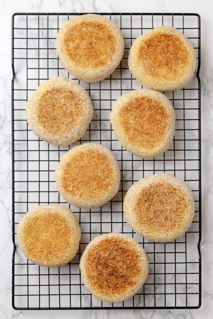 Overhead view of gluten-free English muffins on wire rack